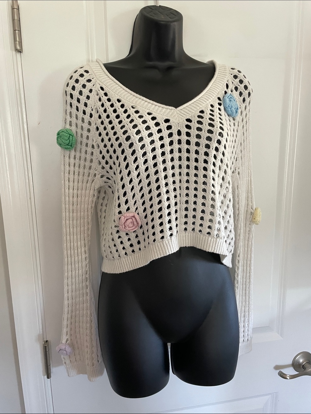 White Open-Knit V-Neck Sweater with Pastel Flower Accents